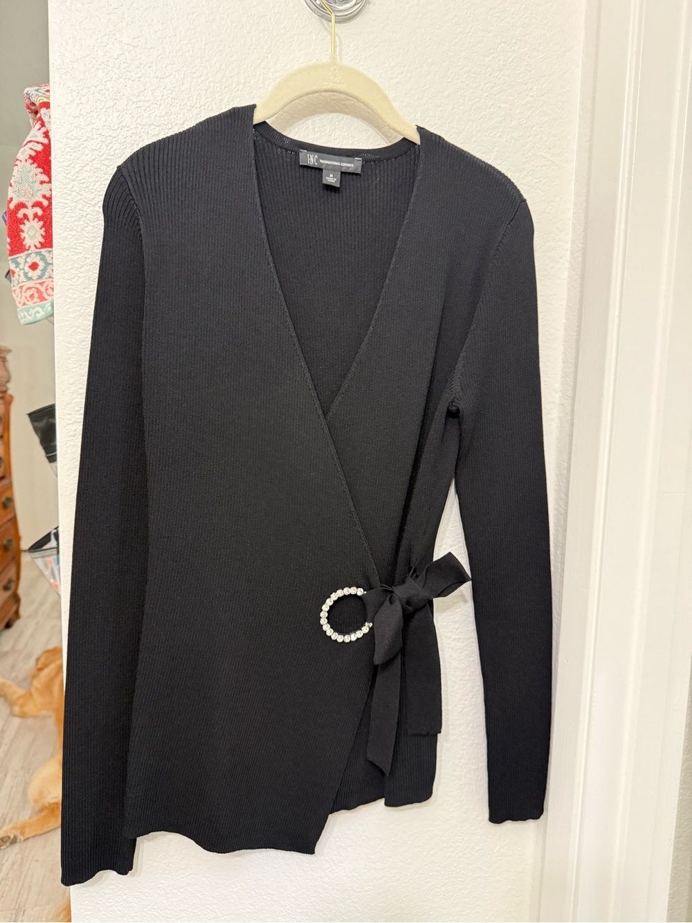 Black Wrap INC Elegant Knit Sweater with Rhinestone Buckle satin bow detail.